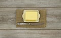 Butter on dish with knife Royalty Free Stock Photo