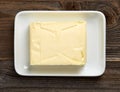 Butter dish on wooden table, from above