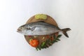 Butter Fish Amberjack Fish Allied kingfish (Seriola Dumerilli) Decorated with herbs and vegetables, white Background.