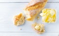 Butter and fresh crunchy homemade bread. Healthy organic breakfast on rustic white wooden table