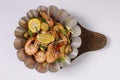 BUTTER GARLIC SHRIMPS BUCKET in a dish top view on grey background singapore food