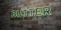 BUTTER - Glowing Neon Sign on stonework wall - 3D rendered royalty free stock illustration