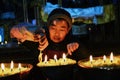 Butter lamps and Tibetan famale