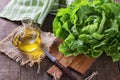 Butter lettuce and oil over wooden rustic background Royalty Free Stock Photo