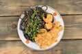 Butter masala with tiger prawns, spaghetti nero and fresh microgreens.