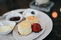 Butter scones served with jam and clotted cream with strawberries on white plate.Breakfast, Traditional English Afternoon Tea, Royalty Free Stock Photo