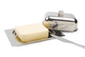 Butter on silver butter dish, knife, isolated Royalty Free Stock Photo