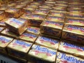 Butter in square packaging is on display in chiller shelves inside the supermarket.