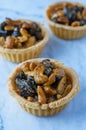 Butter tarts with dried fruit on the marble background