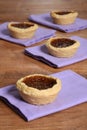 Butter tarts on purple napkin Royalty Free Stock Photo