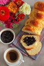 Butter vanilla brioche with cheery jam and coffee for breakfast