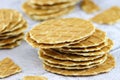 Butter waffle cookies stacked on a grey background. Waffle crisps close-up. Tasty home made thin waffles. Sweet food concept Royalty Free Stock Photo