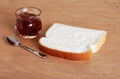 Buttered bread with jam pot Royalty Free Stock Photo