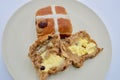 Buttered hot cross buns on a plate Royalty Free Stock Photo