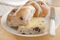 Buttered Hot Cross Buns on Yellow Cloth Royalty Free Stock Photo