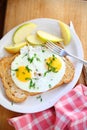 Buttered toast, fried eggs and apples breakfast Royalty Free Stock Photo