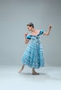 Contemporary ballroom dancer on grey studio background