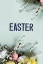 Butterflies and flowers, easter eggs and willow on green background with Happy Easter text. Easter greeting card. Royalty Free Stock Photo