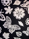 Butterflies, leaves and flowers pattern. Paper cutting. Royalty Free Stock Photo