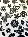 Butterflies, leaves and flowers pattern. Paper cutting.