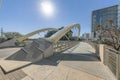 Butterfly bridge in Austin Texas against buildings and sun in the blue sky