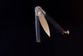 Butterfly knife in semi-complicated condition. Butterfly knife on a black background