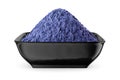 Butterfly pea flower powder or blue matcha in black bowl isolated on white. Front view Royalty Free Stock Photo