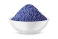 Butterfly pea flower powder or blue matcha in round bowl isolated on white. Front view Royalty Free Stock Photo