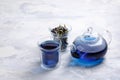 Butterfly pea flower tea is brewed in a glass teapot and served into a transparent cup. Blue herbal tea Royalty Free Stock Photo