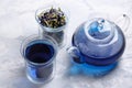 Butterfly pea flower tea is brewed in a glass teapot and served into a transparent cup. Blue herbal tea Royalty Free Stock Photo