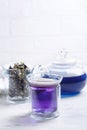 Butterfly pea flower tea is brewed in a glass teapot and served into a transparent cup. Blue herbal tea Royalty Free Stock Photo