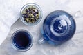 Butterfly pea flower tea is brewed in a glass teapot and served into a transparent cup. Blue herbal tea Royalty Free Stock Photo