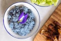 Butterfly pea purple sticky rice, decorated with Butterfly pea flower. Fusion Thai food