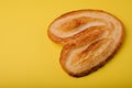 Butterfly puff pastry or palmier cookie on yellow background Royalty Free Stock Photo
