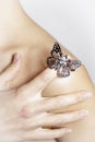 Butterfly ring on woman's finger Royalty Free Stock Photo