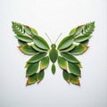 Butterfly shape created using green and brown leaves arranged symmetrically on a Royalty Free Stock Photo