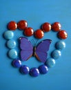 Butterfly in stones heart decorative Royalty Free Stock Photo