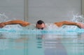 Butterfly stroke in indoor pool Royalty Free Stock Photo