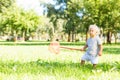 Sweet kid trying to catch butterflies in the garden