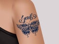 Butterfly Tattoo on female shoulder. Mystic butterfly tattoo with calligraphy Soul.