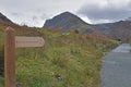 Buttermere Road trail sign with mountain backdrop