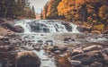 Buttermilk Falls surrounded by brilliant fall foliage in Long Lake NY, ADK Mountains