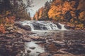 Buttermilk Falls surrounded by brilliant fall foliage in Long Lake NY, ADK Mountains