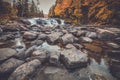 Buttermilk Falls surrounded by brilliant fall foliage in Long Lake NY, ADK Mountains