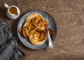 Buttermilk pancake with roasted honey cinnamon apples. Delicious Breakfast on a wooden table