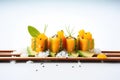 butternut squash cubes on bed of rocket, with sliced avocado, sesame seeds Royalty Free Stock Photo