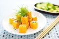 butternut squash cubes on bed of rocket, with sliced avocado, sesame seeds Royalty Free Stock Photo
