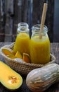 Butternut squash milk bottle, yellow healthy, nutritious drink for breakfast Royalty Free Stock Photo