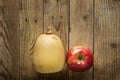 Butternut Squash Pumkpin Ripe Red Apple on Weathered Wood Background. Autumn Fall Thanksgiving Harvest. Copy Space Greeting Card Royalty Free Stock Photo