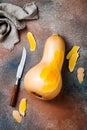 Butternut squash on rustic background. Healthy fall cooking concept.